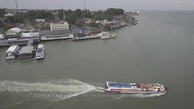 A passenger ferry leaves a port from Tanjung Balai Karimun, Riau Island, to Singapore.