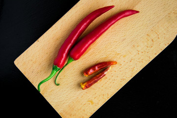 Hot pepper on a wooden board.