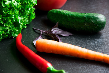 Vegetables on a black background.