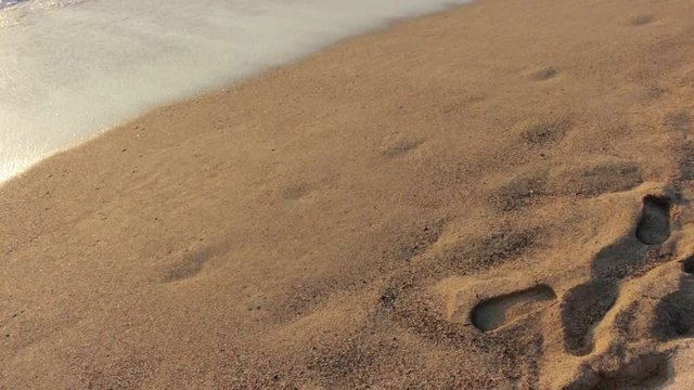 Ocean waves over sandy beach in Mexico holiday destination