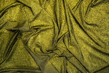 A golden one for a female dress of yellow shining light, a background