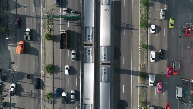 aerial top view electric train on street traffic in city at day, traffic in bangkok thailand.