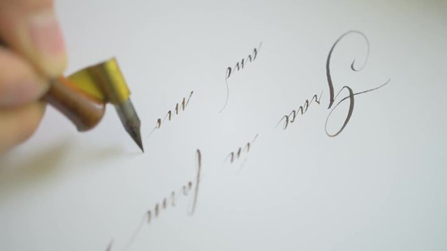 Calligrapher hand writing.