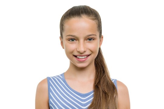 Portrait of beautiful girl of 10, 11 years old. Child with perfect white smile, isolated on white background