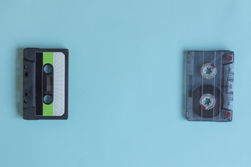 Cassette for tape recorder retro style on pastel color background. Top view. Copy space. Mockup for design.