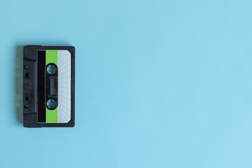 Cassette for tape recorder retro style on pastel color background. Top view. Copy space. Mockup for...
