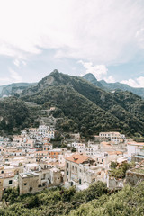 Fototapeta na wymiar Amalfi coast in Italy, the most beautiful city. Streets and old architecture, narrow passages, shops and cafes. View from the sea and above