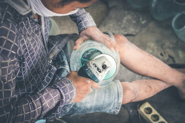 Close-up of a male mechanic with glass polish machine.