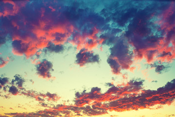 Colorful dramatic evening sky with beautiful clouds. Gradient color