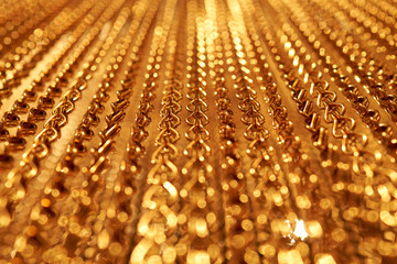smooth movement of long gold chains. Uniform swing. Gold background for relaxation. Meditation....