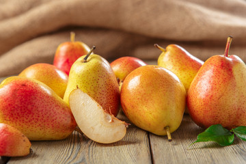 Ripe pears on rustic wooden table