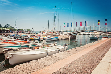 Motor boats in a small harbour of Bardolino