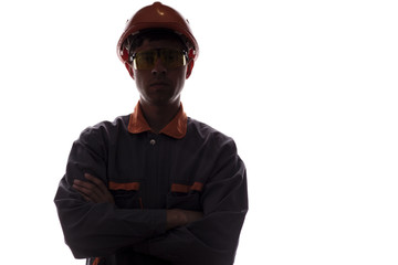 silhouette man construction engineer, portrait of male in helmet and protective glasses on a white...