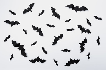 halloween and decoration concept - paper bats flying