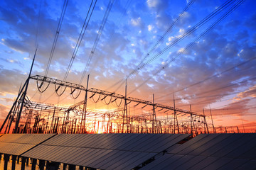 Solar photovoltaic panels and substations in the evening,