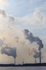 Smoke from the pipes of the factory