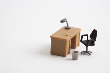 miniature table and chair on white background