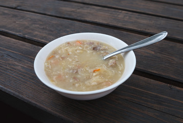 Bowl of soup on a table.