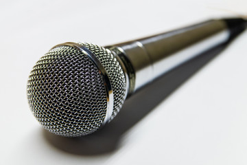 Obraz premium Silver audio microphone on white background