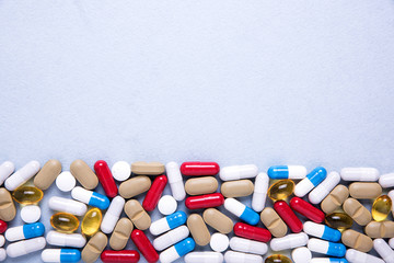 Pharmaceutical preparations, background. Colorful medications Pills, tablets and capsules are scattered. Medical concept