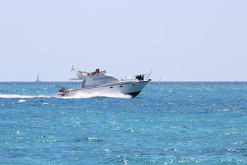 Torre Mozza (Ugento), Lecce, Italy - August 15, 2016 - Day at the seaside, with sports and entertainment (kite surfing, wind surfing and yatch), in August in Salento