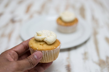 Homemade Vanilla Cupcake in Hand