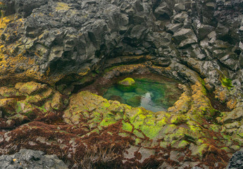 Brimketill naturally carved pool and lava beach in Reykjanes Penninsula, Iceland