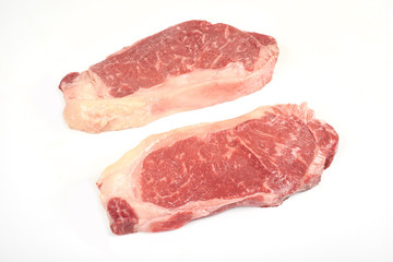 fresh raw steak isolated on white background.