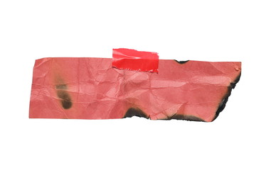 Crumpled pink burned and charred paper with red tape isolated on white background, clipping path