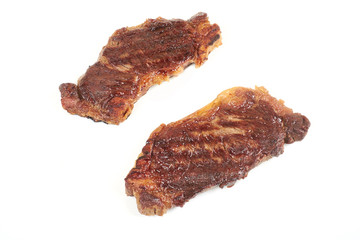 Grilled beef steak isolated over white background.