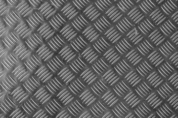 Grey metallic surface pattern.