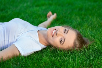 Portrait of a Woman Lying Down on the Grass
