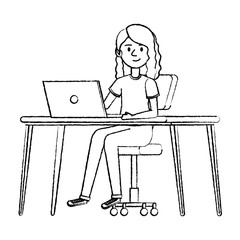 young woman at desk with laptop