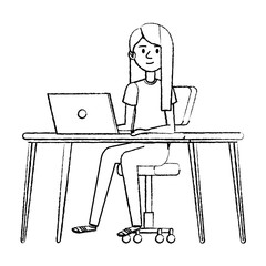 young woman at desk with laptop