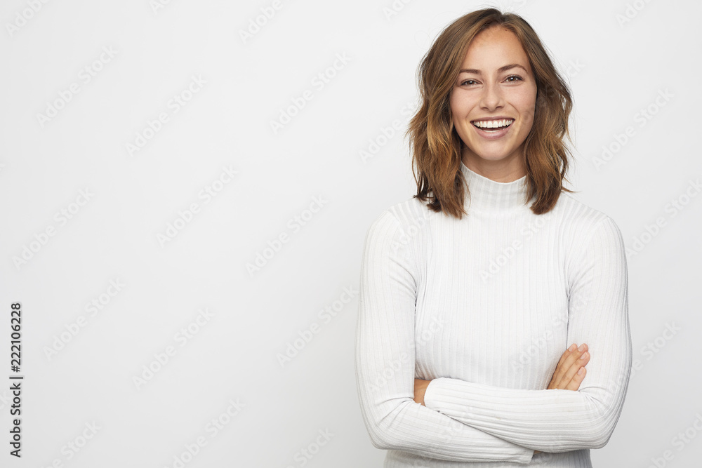 Wall mural portrait of young happy woman looks in camera - Wall murals