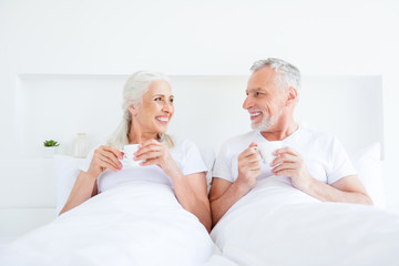 Lazy, holiday concept. Portrait of two gray hair cheerful people