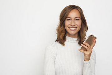 portrait of young beautyful woman on the phone looks in camera