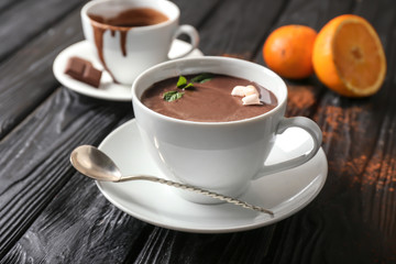 Cup of hot chocolate on wooden table