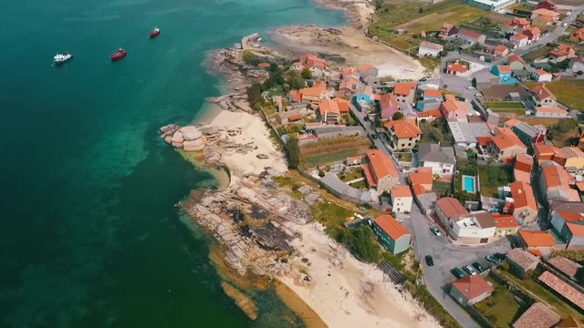 Aerial view of a beautiful landscape including traditional houses of the seaside at Boiro village, Galicia.
