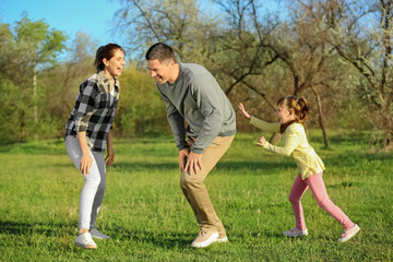 Happy family in park on sunny day