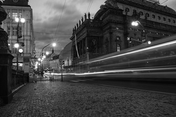 Prague tram by night with light trails and ghost effect