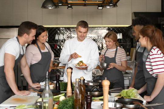 Chef And Group Of Young People During Cooking Classes