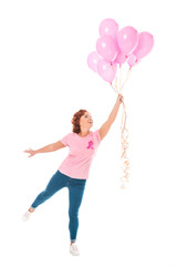 cheerful woman holding bunch of pink balloons isolated on white, breast cancer concept