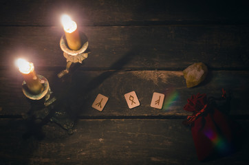 Magic divination runes on fortune teller desk table background. Futune reading concept.