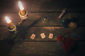 Fototapeta na wymiar Magic divination runes on fortune teller desk table background. Futune reading concept.