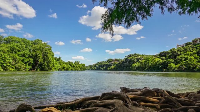 Motion time-lapse of Lady Bird Lake as seen from Red Bud Isle on a clear sunny Austin, Texas day.