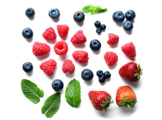 Delicious ripe berries on white background, top view