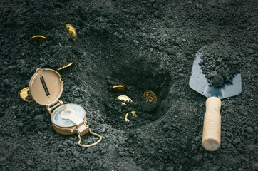 Coins searching. Treasure hunting concept. In search of a lost treasure.