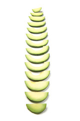 Slices of ripe avocado on white background