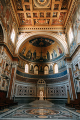 Obraz premium Salvatore Church in Rome, view from outside and inside. Frescoes and statues, architectural elements. A historic landmark, tourist destination. Ancient painting